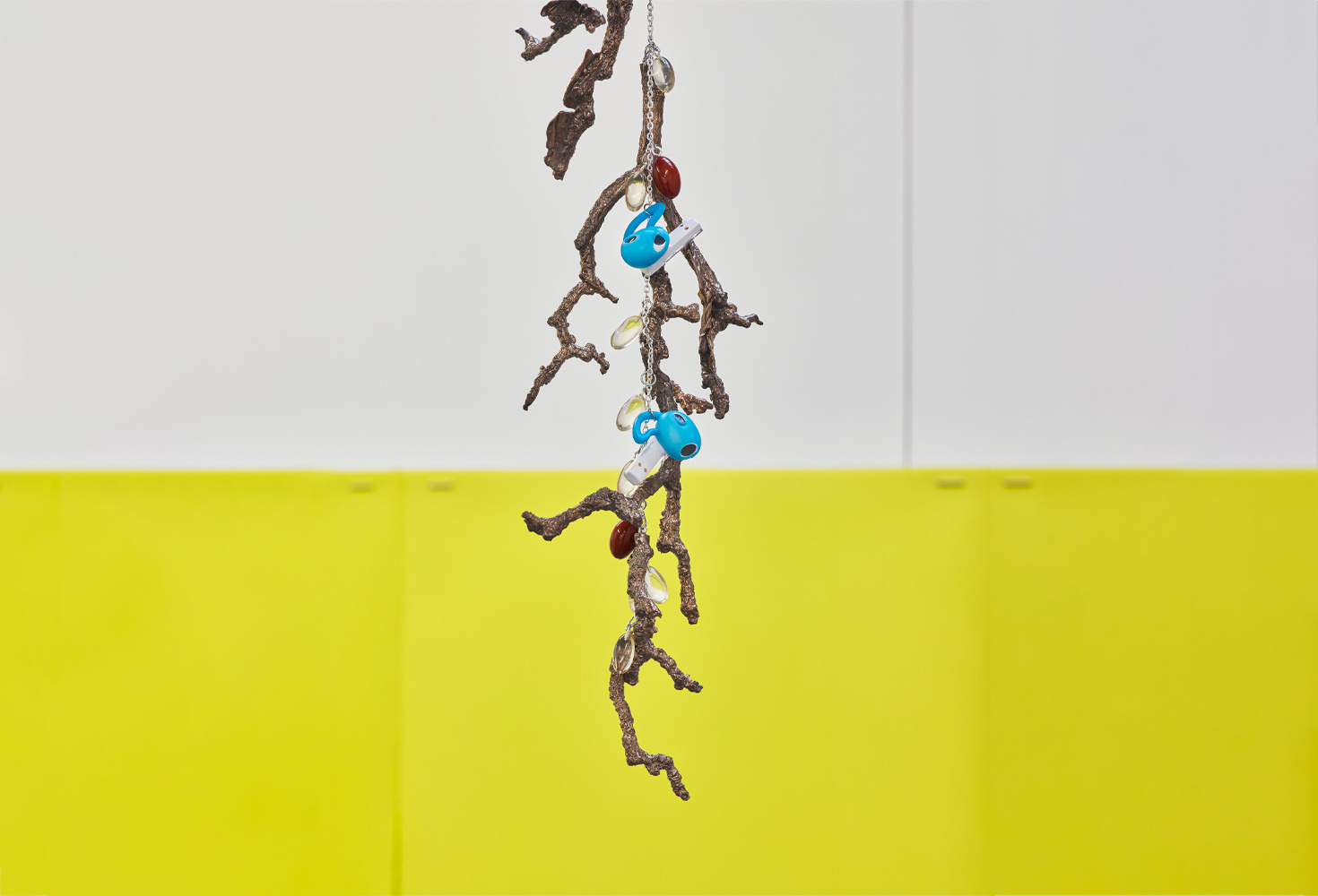 Optimal Functioning (I, detail image) bronze, steel, PU, vitamin capsules, earbuds, sound, silicon, salt (2024). Courtesy of Reinis Lismanis, No Show Space and Commonage London